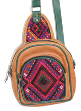 Load image into Gallery viewer, MoonLake Designs Blake Sling Over Backpack Bag in pear tan handcrafted leather with eye catching geometric huipil in shades of pinks and blues featuring dark green leather adjustable strap and multiple easy access pockets perfect for concerts or traveling