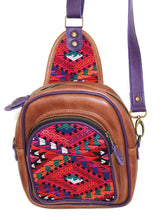 Load image into Gallery viewer, MoonLake Designs Blake Sling Over Backpack Bag in medium tan leather with fun mayan huipil design in pink green orange and red with purple leather adjustable strap and accents and multiple easy access pockets perfect for concerts or traveling