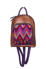 Load image into Gallery viewer, Petite small cute backpack purse in a medium tan leather and purple leather straps and accent. It has double zipper openings. Front pocket has storage for pens and credit cards. Main compartment has two open pockets and a zipper pocket.