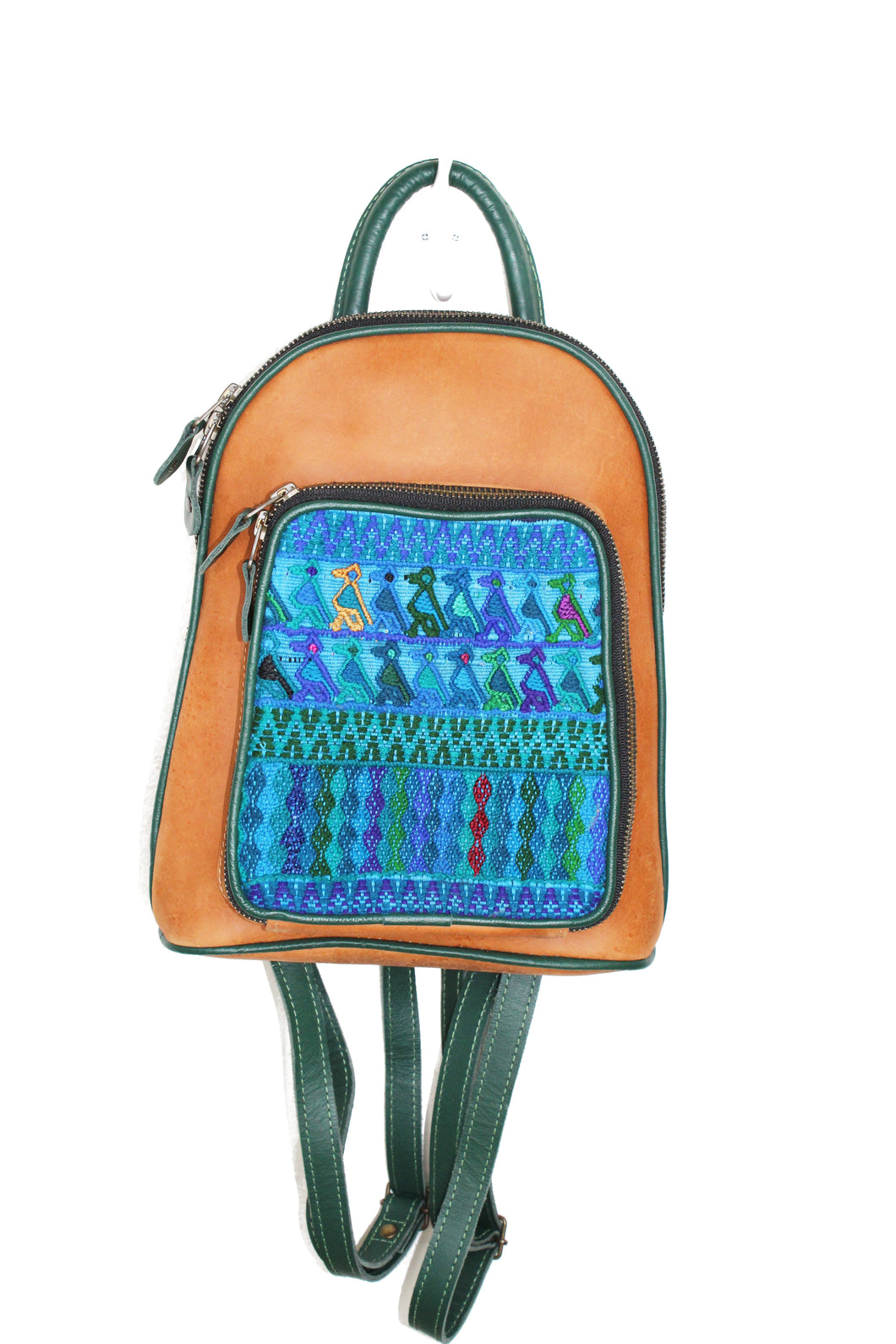 Petite small cute backpack purse in pear leather and dark green leather straps and accent. It has double zipper openings. Front pocket has storage for pens and credit cards. Main compartment has two open pockets and a zipper pocket.