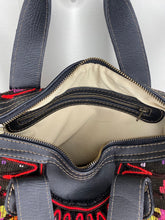 Load image into Gallery viewer, Close up of MoonLake Designs Elena Convertible Day Bag interior with cream lining, zippered pocket, and zippered bag closure 