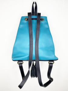 MoonLake Designs Maya bucket backpack back view of full electric blue leather and adjustable black leather backpack straps with hang loop