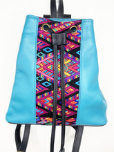 Load image into Gallery viewer, MoonLake Designs Maya bucket backpack in handcrafted electric blue leather close up view of geometric huipil design in black, electric blue, purple, yellow, and pink 
