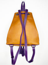 Load image into Gallery viewer, MoonLake Designs Maya bucket backpack back view of full pear tan leather and adjustable purple leather backpack straps with hang loop