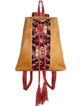 Load image into Gallery viewer, MoonLake Designs Maya bucket backpack in handcrafted pear tan leather with Mayan geometric huipil design and rusty red leather draw straps, backpack straps, and fringe ties