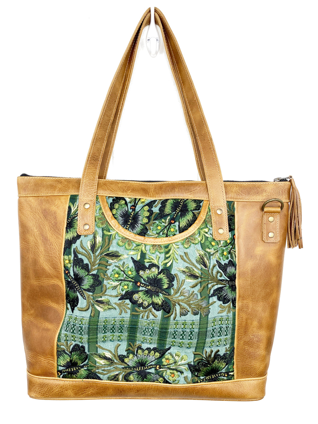 MoonLake Designs Olivia Large Tote Bag in light tan handcrafted leather with mesmerizing floral huipil design in shades of greens and leather tassel zipper closure