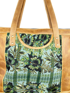 MoonLake Designs Olivia Large Tote Bag in light tan handcrafted leather close up of handwoven green floral huipil design and exterior open pocket