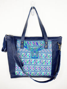 MoonLake Designs Olivia Large Tote Bag in textured navy blue handcrafted leather close up of handwoven floral huipil design and adjustable shoulder strap