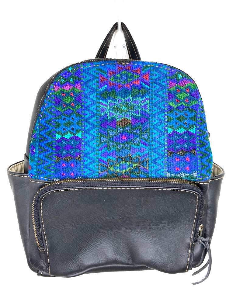 MoonLake Designs handmade Paloma small backpack in Black Leather with eye catching handwoven blues and purple geometric huipil design covering front top