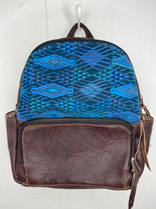 MoonLake Designs handmade Paloma small backpack in Textured Dark Chocolate Leather with eye catching handwoven blue huipil design covering front top
