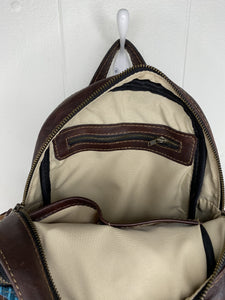 MoonLake Designs Paloma backpack inside view of cream interior and zippered inner compartment