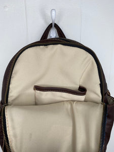 MoonLake Designs Paloma backpack inside view of cream interior and small slide in pocket