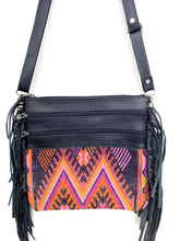 Load image into Gallery viewer, MoonLake Designs Penelope Flecos crossbody bag with fringe in black leather, three zipper compartments, and geometric orange red purple and black huipil design
