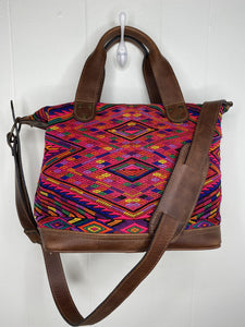 MoonLake Designs handmade Renata Medium Maleta Crossbody Bag in Dark Tan leather with handwoven huipil design featuring pinks, purples, oranges and more