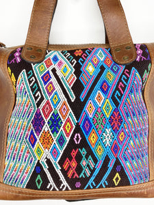 MoonLake Designs close up view of Renata huipil design including varying diamond sizes with white, blue, red, yellow, and green