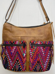 MoonLake Designs Rosa Crossbody in light tan leather with pink huipil design on double zippered outer pockets close up view