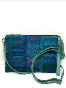 MoonLake Designs Lola small bag and clutch in teal leather with handwoven textile featuring different shades of blue and teal